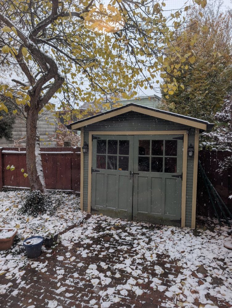 Pic of our back yard with a dusting of snow. Zoom in to see snow flakes falling. 