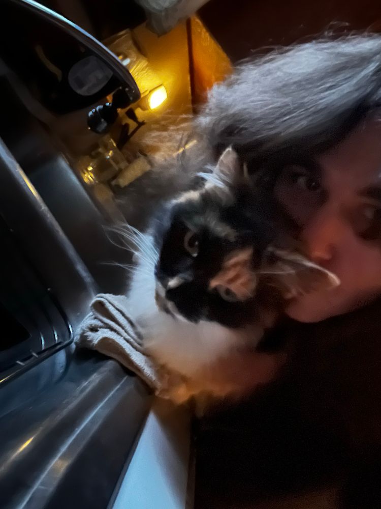 Op and their calico cat Precious 