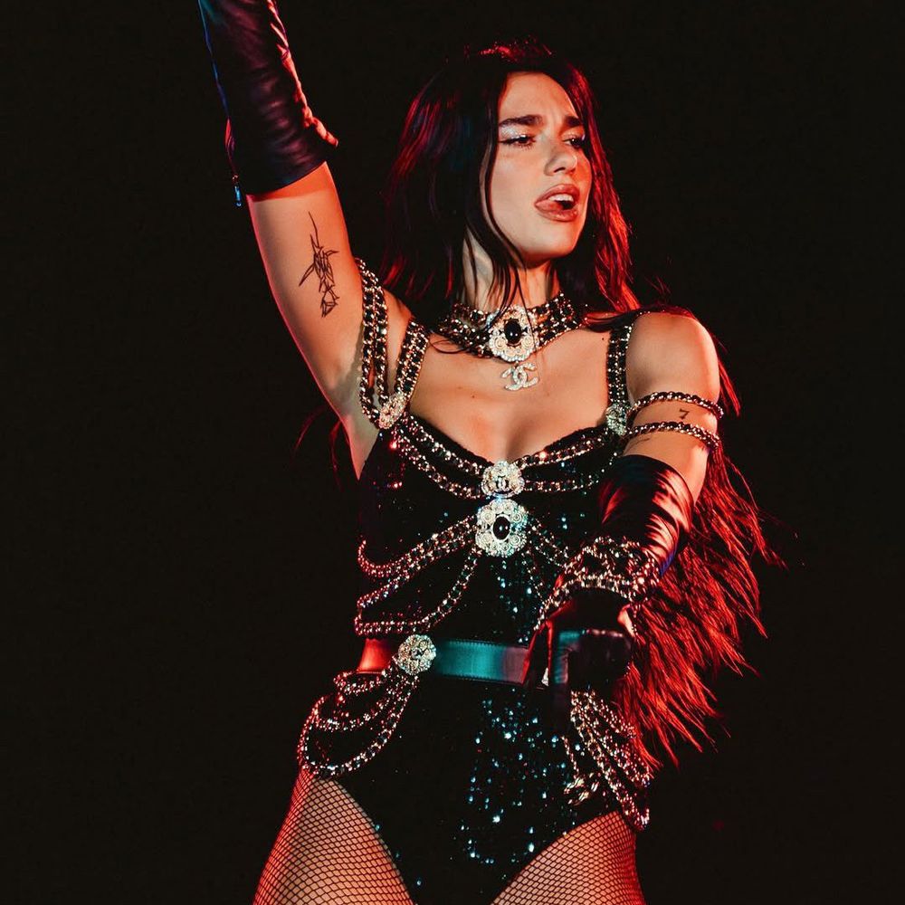 Dua Lipa on tour with a black bodysuit 