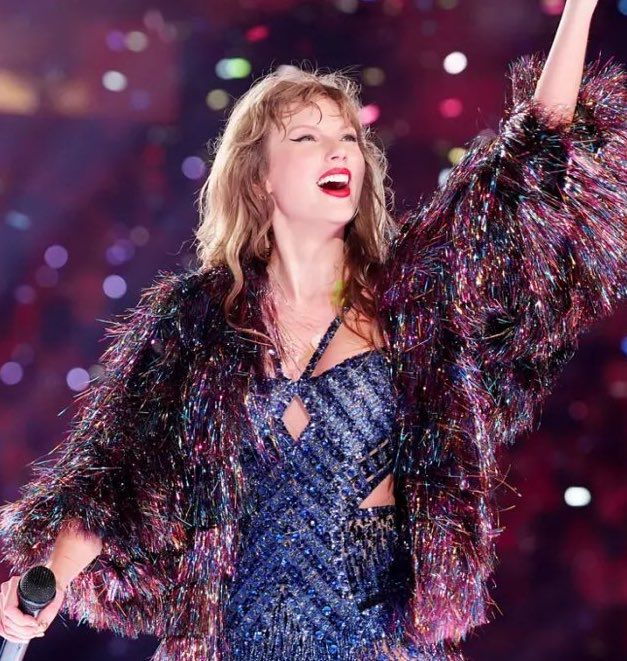 Taylor Swift with the multicolor karma jacket