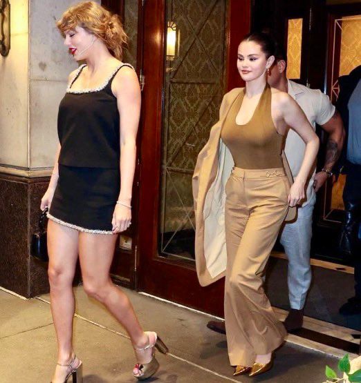 Taylor Swift wearing a black dress out in NYC yesterday 
