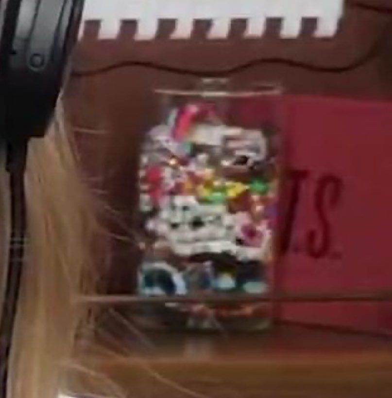 Screenshot of Taylor Swift’s preview as a guest on the “bew heights” podcast showing a TS on a red cover on the background 