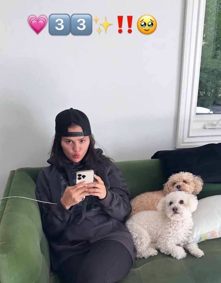 Picture of Selena Gomez wearing the black eras tour hoodied