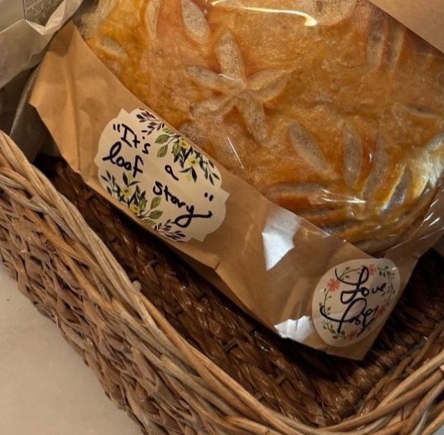 Bread loaf that Taylor baked for benny blanco and selena gomez that read “it’s a loaf story”