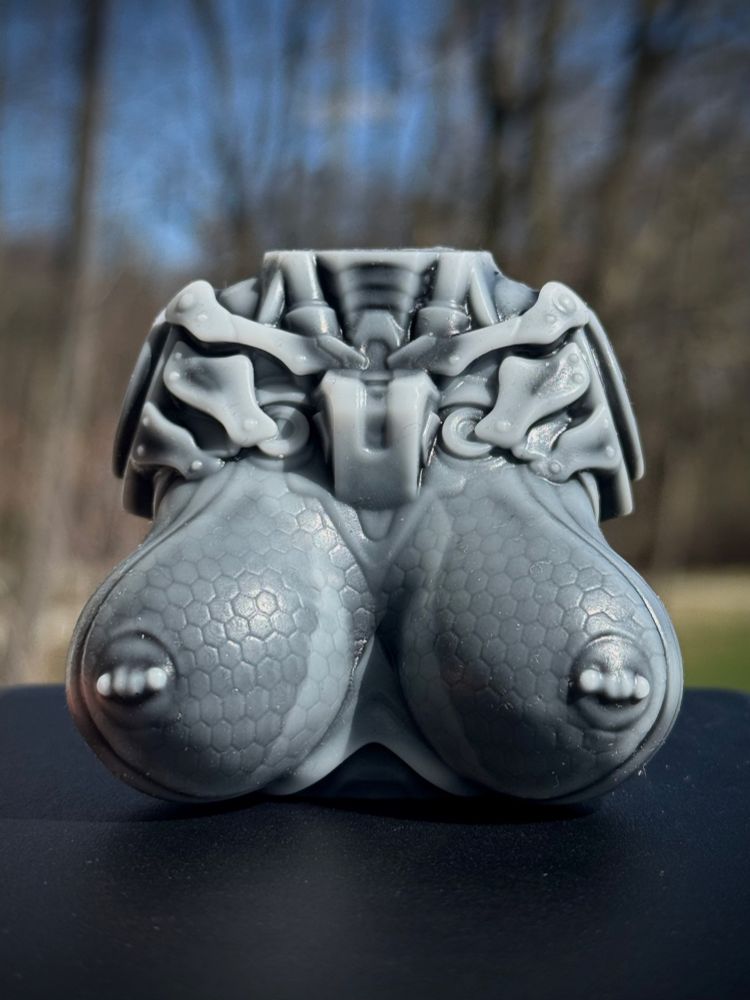 Petite size Tyramyth’s Bust from Xenocat Artifacts in a grey-white wash, pictured with bare trees in the background