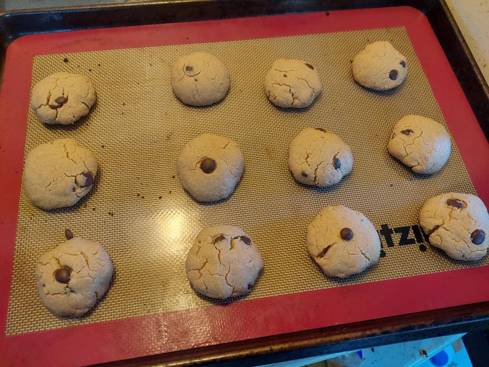 Peanut butter cookies cooling on a tray.
