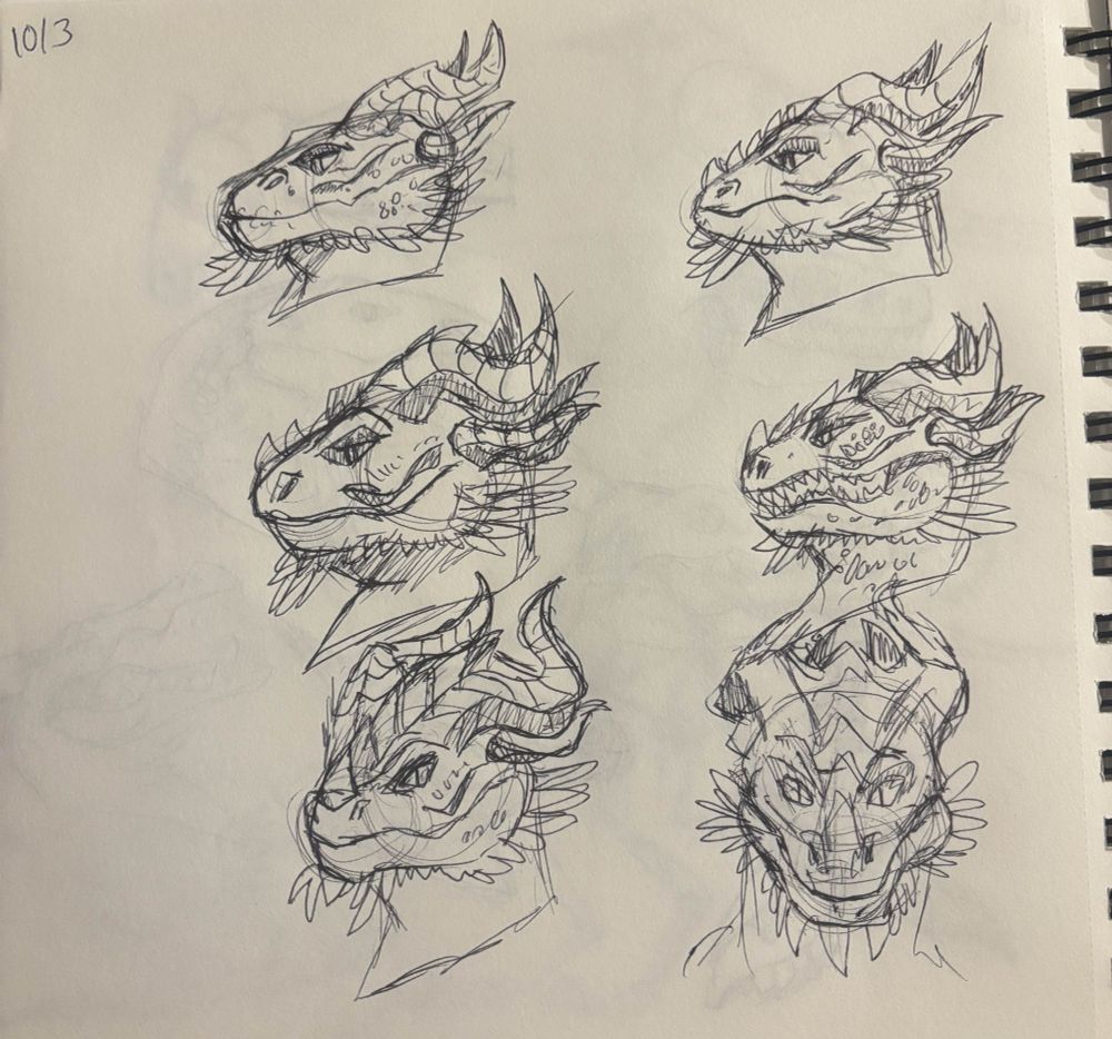 image is of six dragon heads doodled in black pen