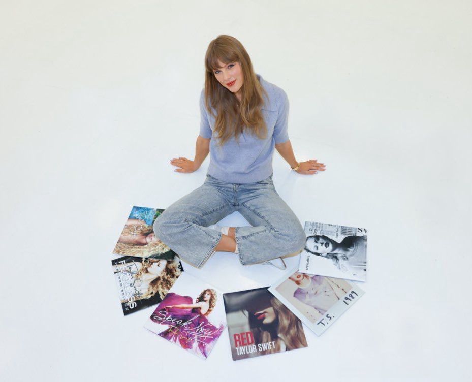 Taylor Swift with her first six albums.
