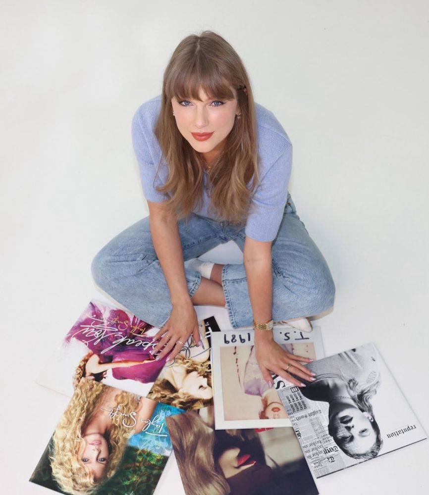 Taylor Swift with her first six albums.