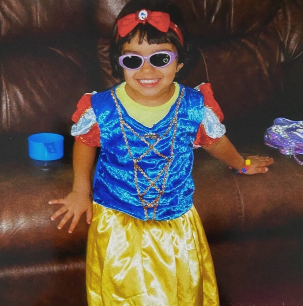 Rachel Zegler as a child in a Snow White costume.