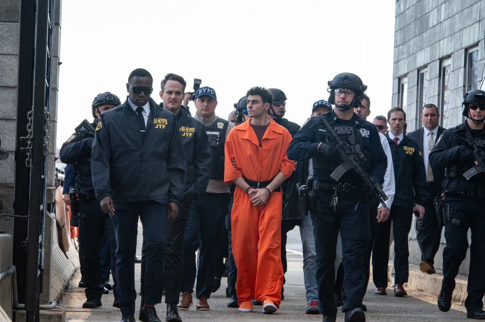 Luigi Mangione being escorted by the NYPD.