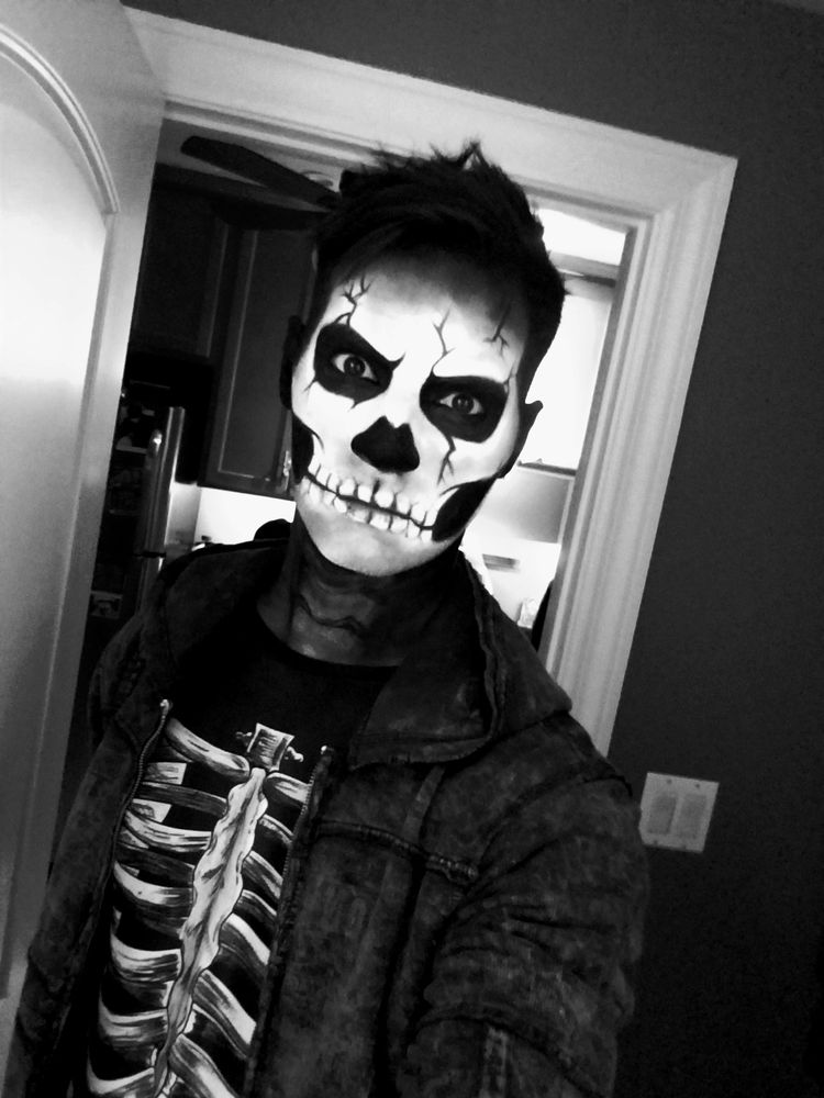 selfie in skeleton makeup costume and hoodie