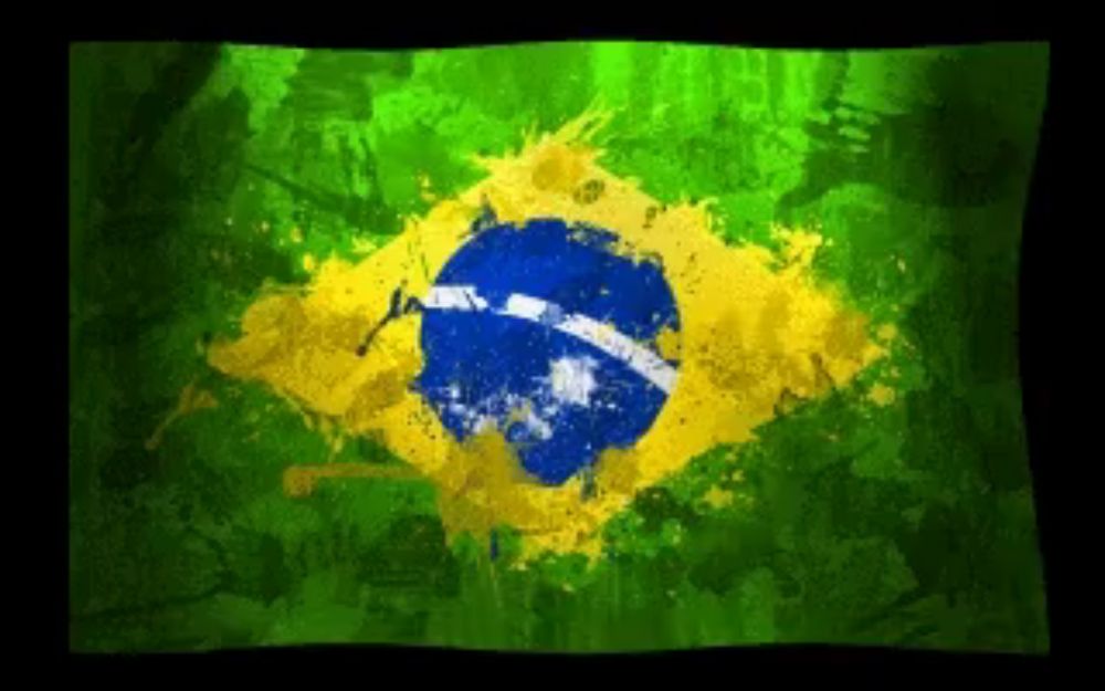 a green and yellow flag with a blue circle in the center