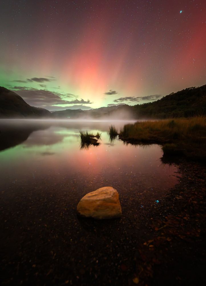 Northern lights Display over a lake in wales 
Long exposure photography 