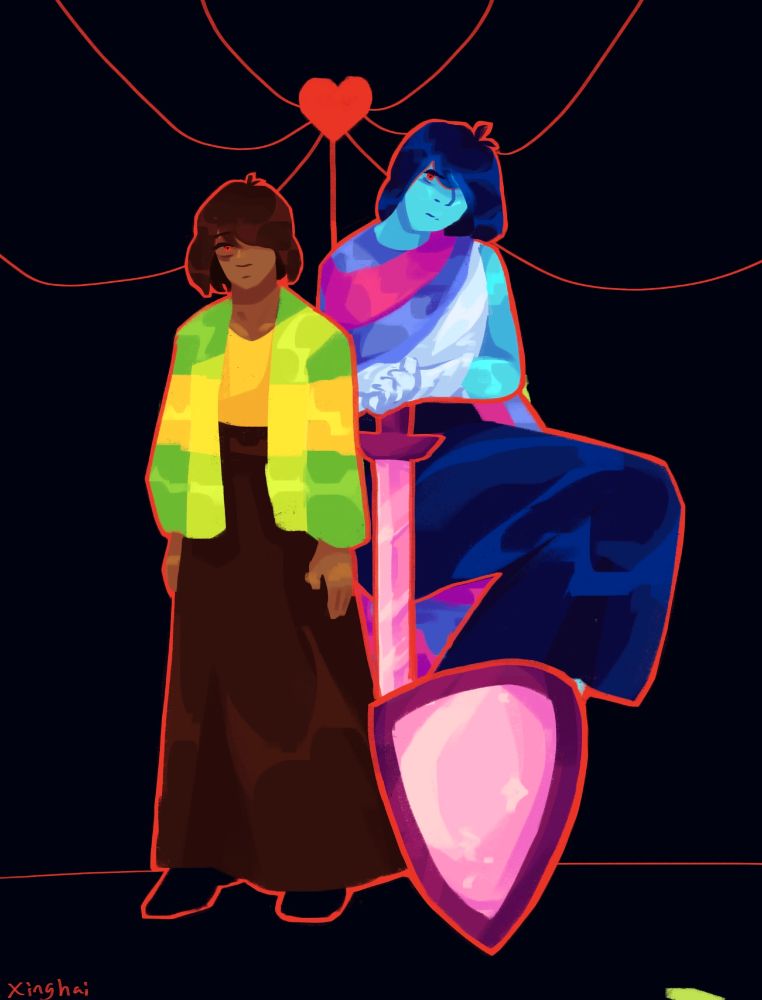 Kris standing on a black background. They are wearing skirts. 