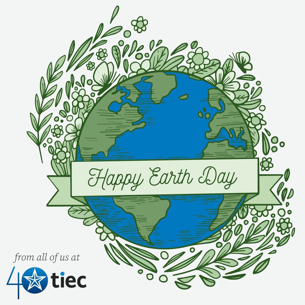 Image shows an illustration of earth surrounded by leaves and flowers, with a ribbon banner across it that reads, "Happy Earth Day"