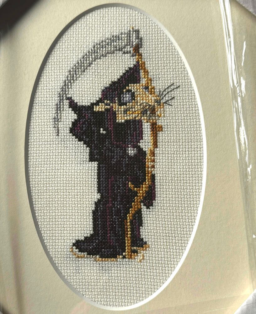 Cross stitch of a black robed skeleton of a rat holding scythe 