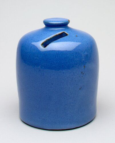 blue cylinder shape; knob top; coin slot in top