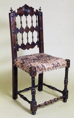 carved side chair, wood and upholstery
