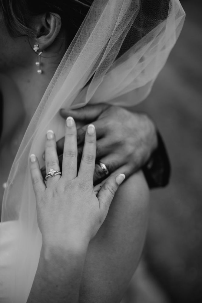 Cat and her husband showing off their rings