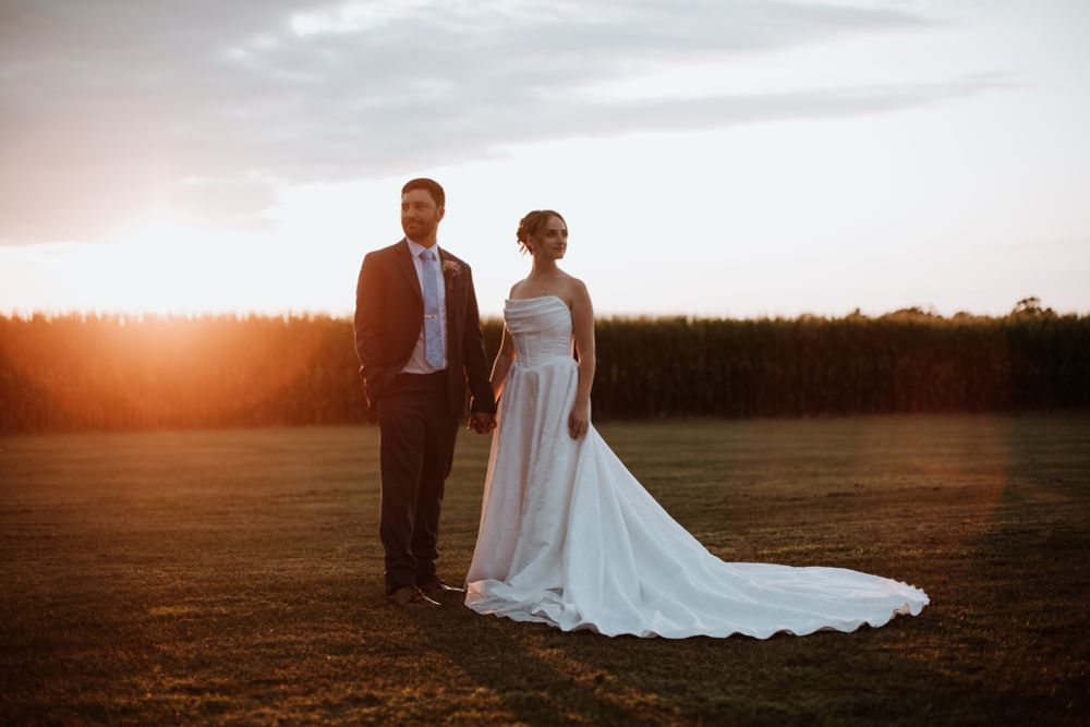 Cat and her husband on their wedding day during golden hour