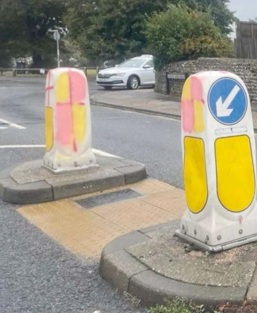 St George’s flag bollards painted as pink and yellow battenberg cakes