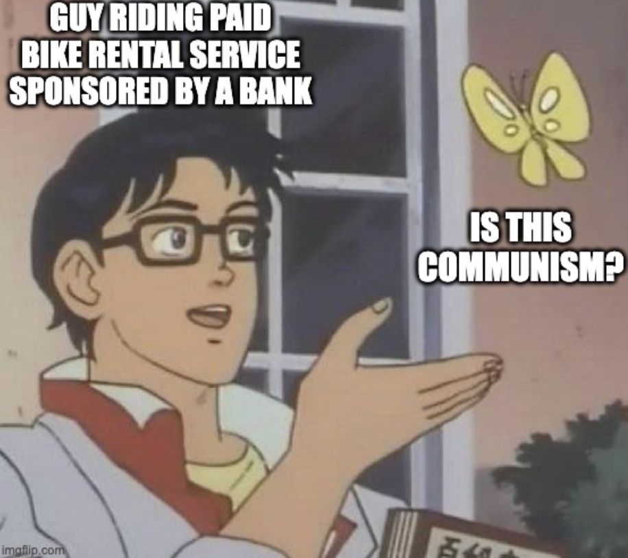 Anime meme of guy in black glasses looking at butterfly. Over the guy it says "Guy riding paid bike rental service sponsored by a bank." Under the butterfly it says "Is this communism?"