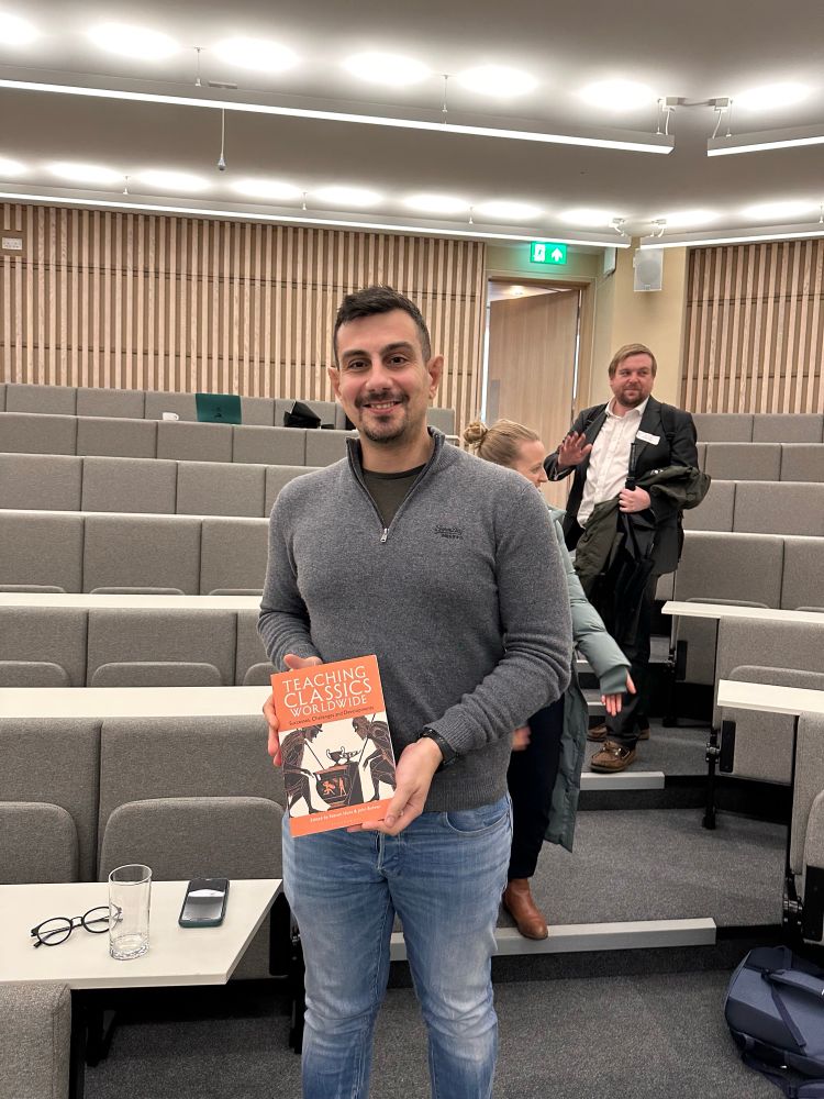Teacher holding book
