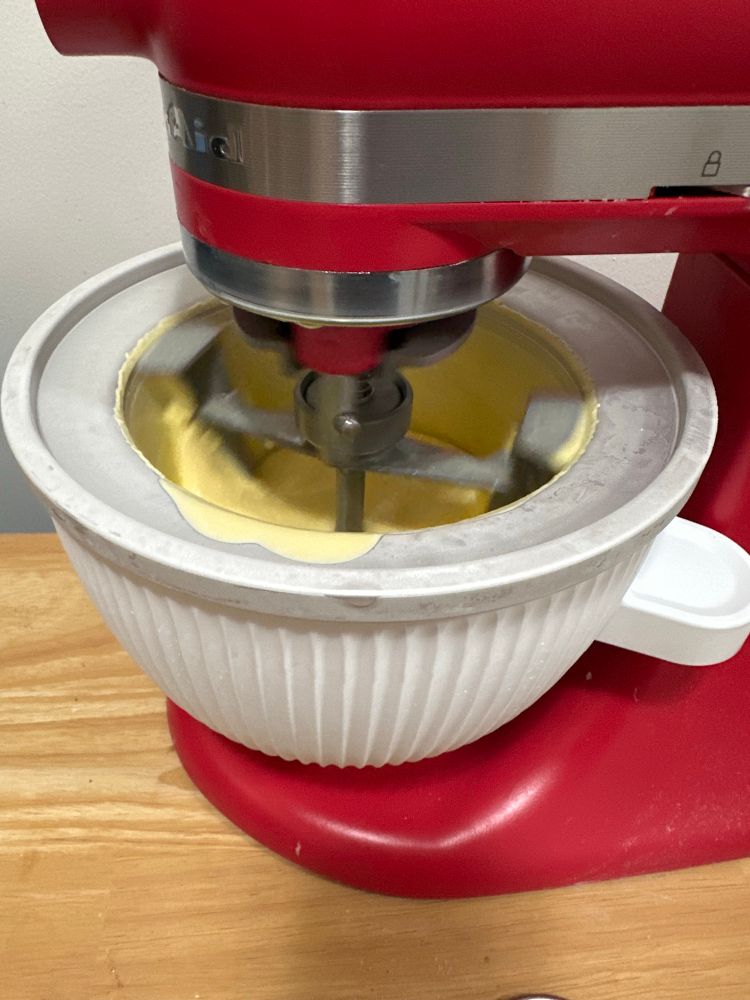 Photo of pink kitchenaid with ice cream maker attachment churning vanilla ice cream