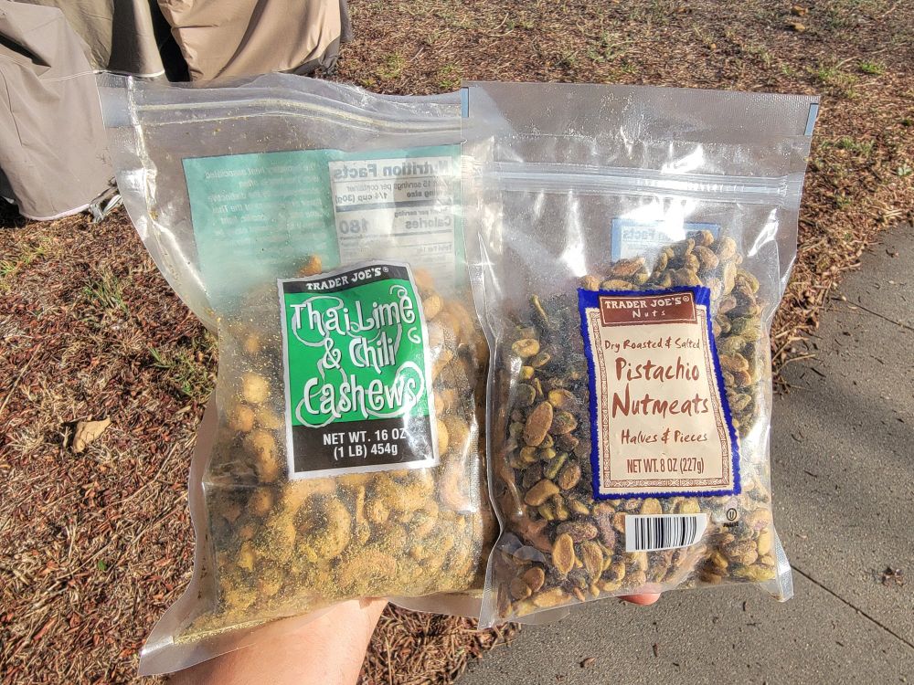 A bag of Thai Lime & Chili Cashews and a bag of Pistachio Nutmeats