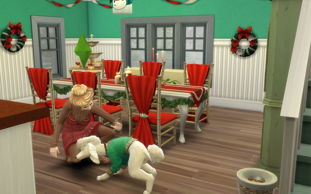 A Sims 4 screenshot of a holiday-decorated livingroom with a Sim and her green-sweater-wearing white poodle