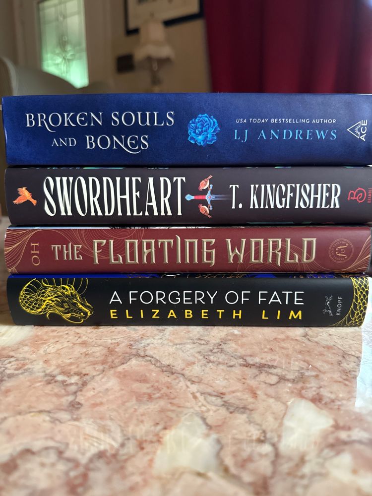4 books sit in a stack with the spines facing out 

A Forgery of Fate by Elizabeth Lim 
The Floating World by Axie Oh
Swordheart by T. Kingfisher
Broken Souls & Bones by LJ Andrews
