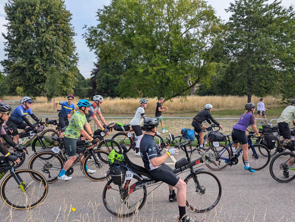 A group of cyclists sets off from the LEL 2025 start line in Writtle, UK. 