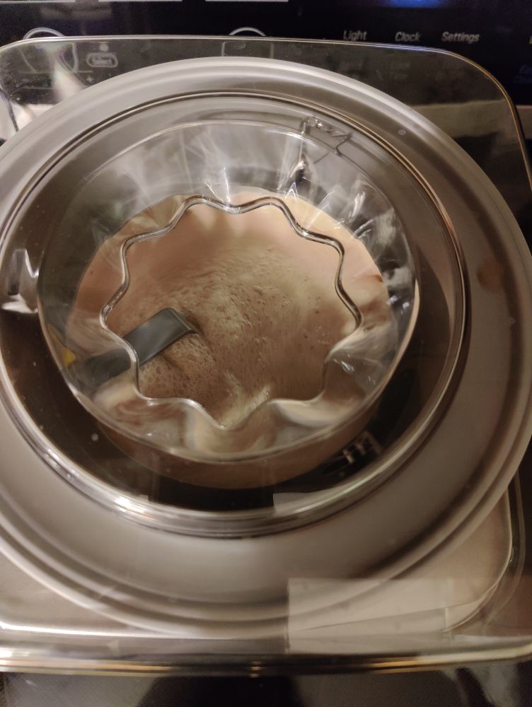 Minty chocolate ice cream spinning itself into deliciousness inside my magic machine (a Cuisinart).