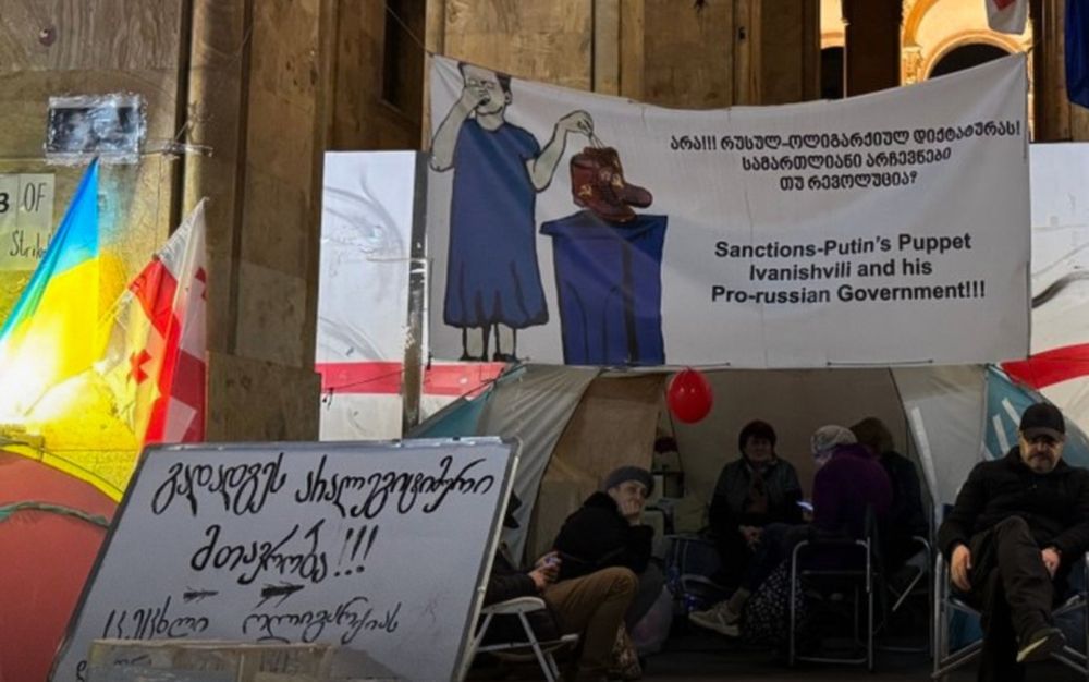 A group of Georgian protesters keep 24/7 vigil in front of parliament for a long time