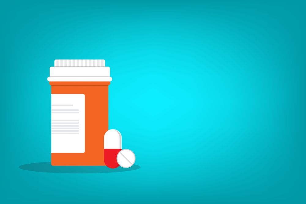 Illustration of prescription drug bottle, pills
