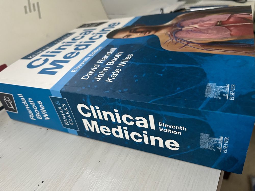 A textbook - Kumar and Clark’s Text Book of Clinical Medicine on a table. 11th edition. 