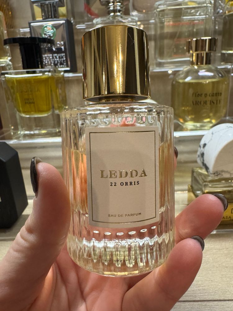 Bottle of Ledda 22 Orris perfume. Clear bottle with gold cap