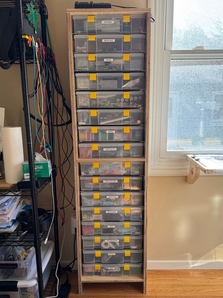 The shelving unit complete with utility boxes placed inside