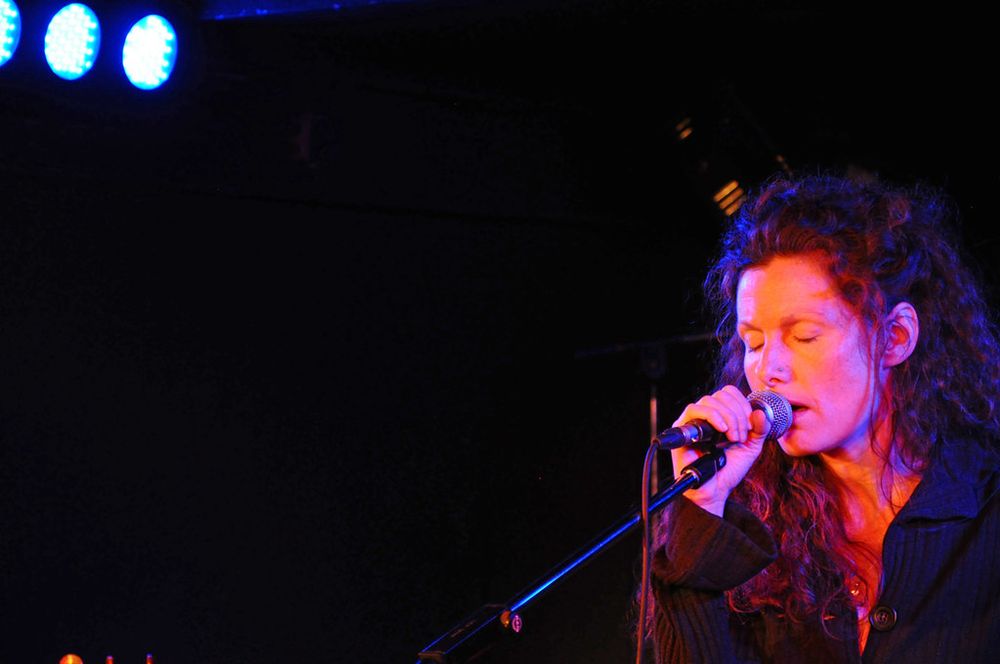 Photo of vocalist Caroline Crawley performing onstage.
