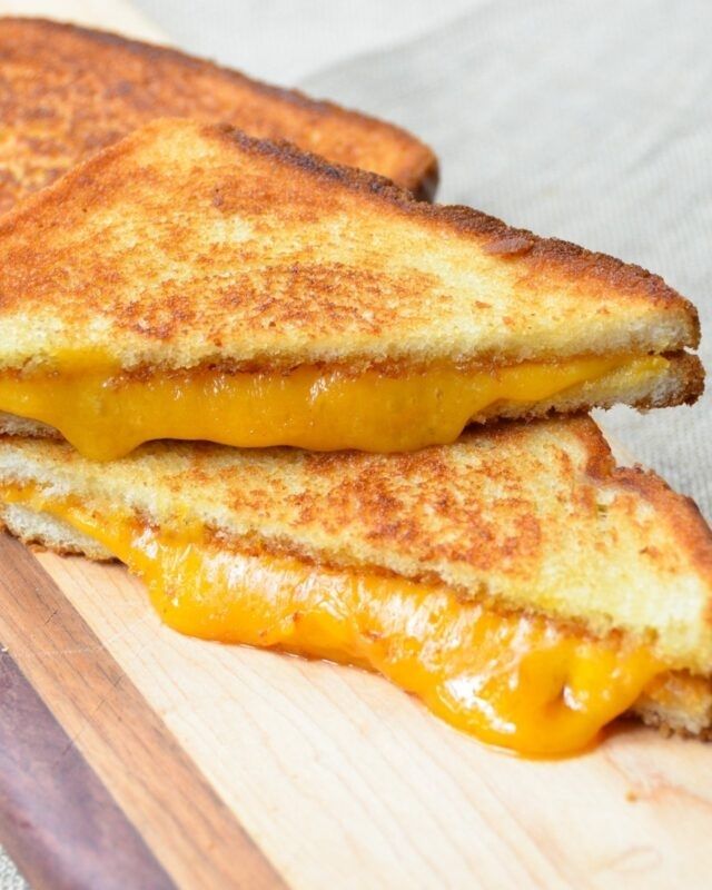 Extra melty grilled cheese sandwich, cut the only proper - diagonal way!