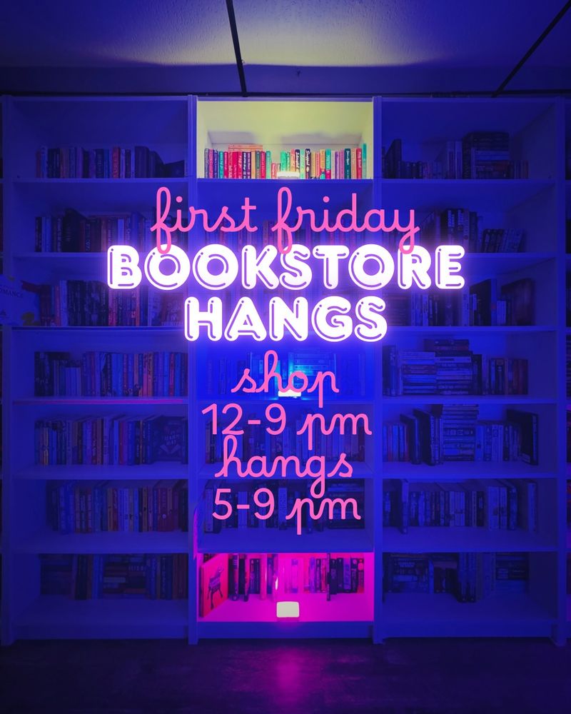 A stretch of Lit.'s tall white bookcases are illuminated in the background with black lights, with accents of yellow along the top shelf and pink across the bottom shelf. Event details are overlaid in neon and pink script which reads
"First Friday Bookstore Hangs Shop noon-9 pm Hangs 5-9 pm"