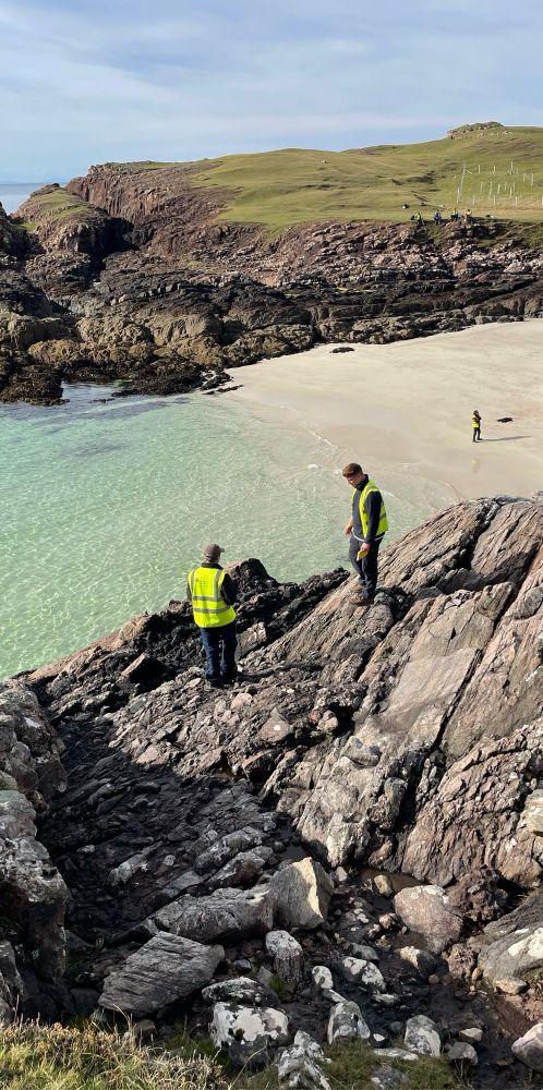 Students standing on rock outcrop 