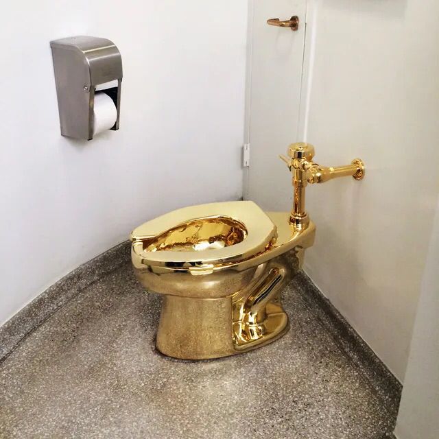 Golden toilet for the tacky felon.