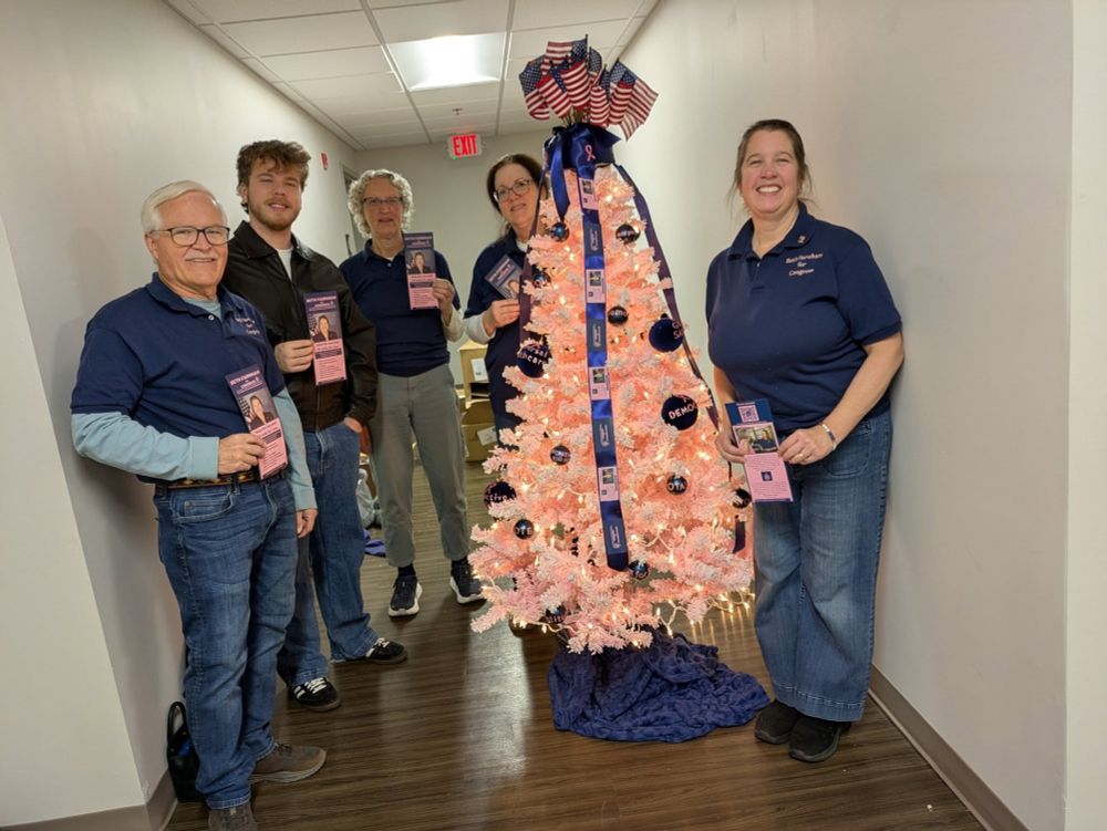 Beth Farnham (right of Christmas tree) and campaign volunteers (Sandy, Jack, Maribeth, and Ike) after decorating a tree at the Franklin County Visitors Bureau.