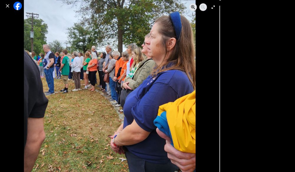 Beth Farnham and others standing silently in solidarity.