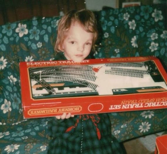 Me as a 5 year old holding my Hornby Intercity 125 train set.