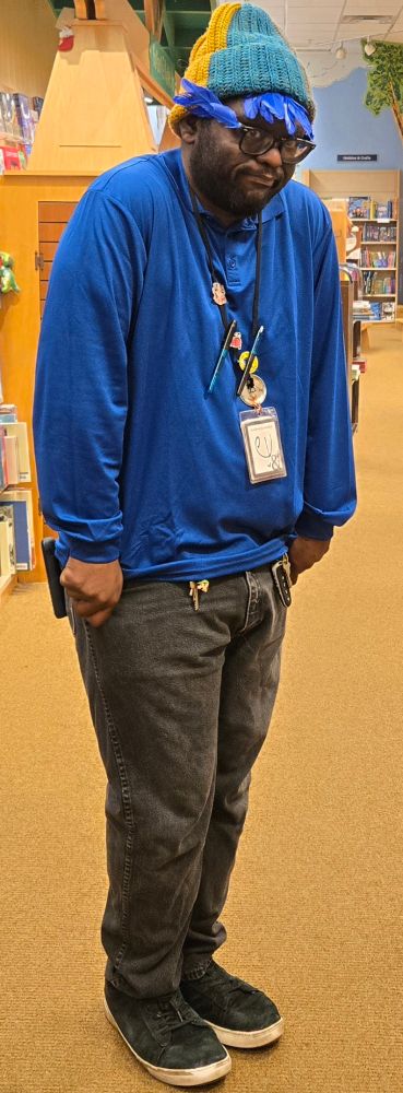 Me dressed in a blue shirt and black jeans as Mordecai from Regular Show. 