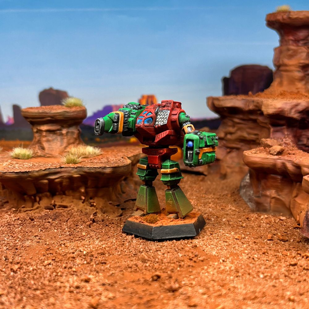 Lao Hu battlemech painted in 9th Sian Dragoons scheme. Red torso, green limbs, with orange highlights. Used a blue jeweling effect for contrast on the canopy. 