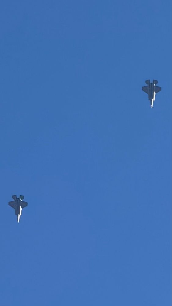 2 fighter jets against a blue sky